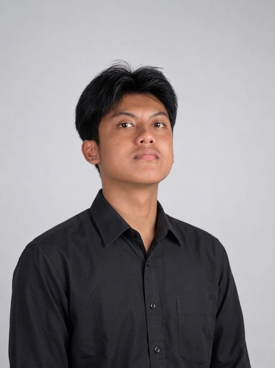 M. Nadiril Khoir in a black shirt against a light grey studio backdrop